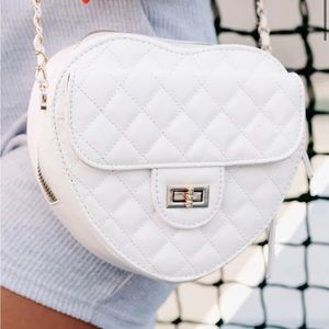 Never used white heart shaped purse